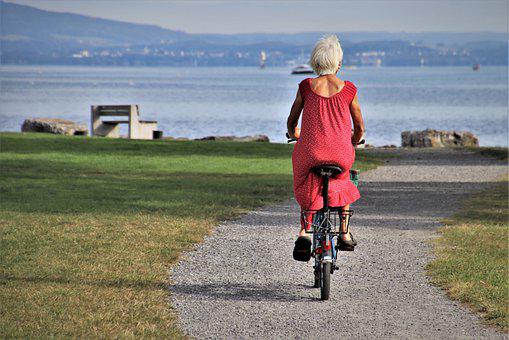 lovely retired woman on a bike